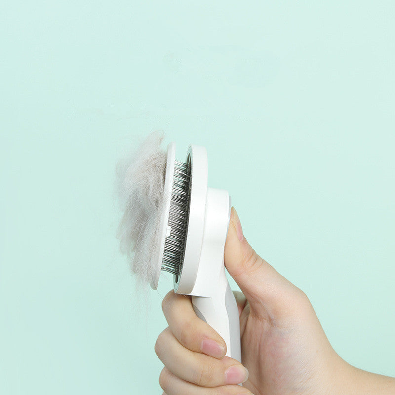 KFX-6997693 Round Handle Self-Cleaning Pet Comb with Stainless Steel Needles and Sticky Bead Design