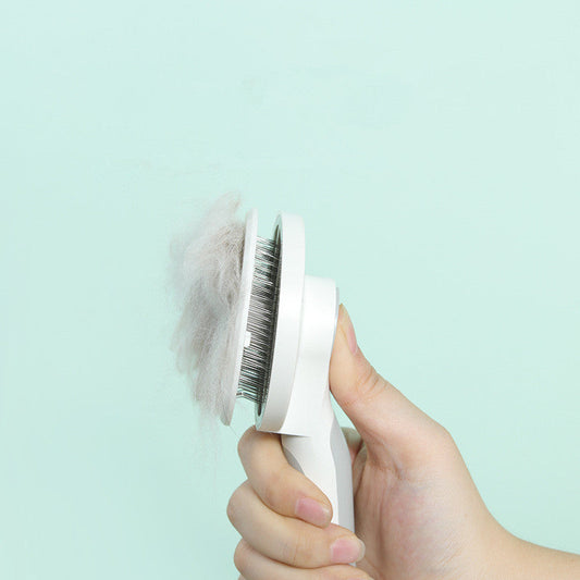 KFX-6997693 Round Handle Self-Cleaning Pet Comb with Stainless Steel Needles and Sticky Bead Design